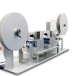 Cut to length station with unwind, punch station, and dual tape station