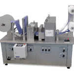 Cut to length system to unwind, slit, cut and rewind tape from roll