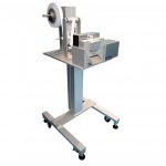 Cut to length system unwinds and cuts hook & loop and elastic