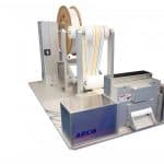 Cut to length system cuts test strip material in roll form