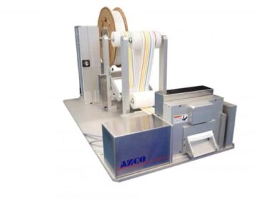 Cut to length system cuts test strip material in roll form