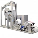 Cut to length unwinds magnetic rubber strip material, removes and rewinds release liner, places strip onto an aluminum extrusion, and cuts it to length