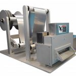 Cut to length station unwinds stainless steel sheet metal in roll form and cuts it to length