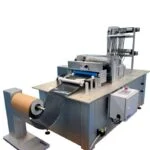 Crush cut slitter station slits rubberized caulk material and rewinds the slit material