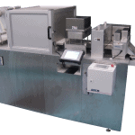 Cut to length station unwinds, feeds, micro-perforates, punches, and cuts nonwoven material