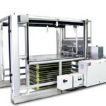 Sheeter with heavy duty unwind and automated stacking system