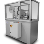 Cut to length station with interlocked safety enclosure unwinds, cuts, and rewinds acrylic material