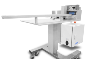 Pictured here is the FG110 cut-to-length assembly, which we designed to precisely cut thin metal pieces with an adhesive backing.